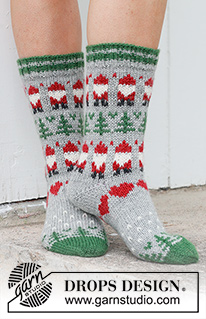 Christmas Time Socks / DROPS 234-63 - Ylhäältä alas neulotut sukat DROPS Karisma-langasta. Työssä on kirjoneuletta, tonttukuvio, joulukuusikuvio ja sydänkuvio. Koot 35 - 43. Teema: Joulu.