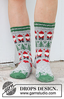 Christmas Time Socks / DROPS 234-63 - Ylhäältä alas neulotut sukat DROPS Karisma-langasta. Työssä on kirjoneuletta, tonttukuvio, joulukuusikuvio ja sydänkuvio. Koot 35 - 43. Teema: Joulu.