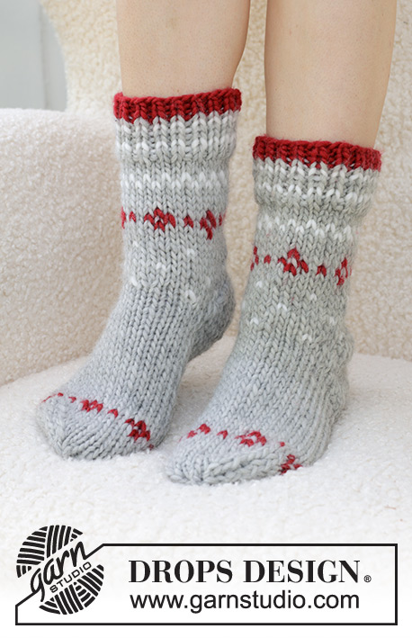 Christmas Sparkle Socks / DROPS 234-75 - Knitted socks in DROPS Snow. Piece is knitted top down with stockinette stitch and Nordic pattern. Size 35 to 43 = US 4 ½ to 12 ½ Theme: Christmas.
