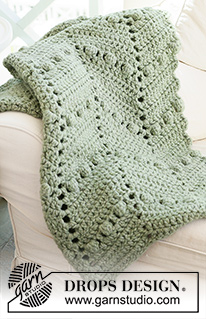 Scent of Pines / DROPS 234-8 - Crocheted blanket in 2 strands DROPS Wish or 1 strand DROPS Polaris. Piece is crocheted with zig-zag and bobbles.
