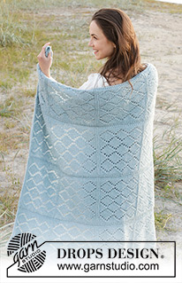 Seaside Shimmer / DROPS 238-1 - Knitted blanket in DROPS Sky and DROPS Brushed Alpaca Silk. The piece is worked back and forth in strips, with garter stitch and lace pattern.