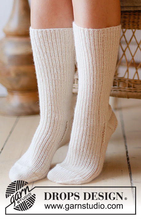 Coconut Cream / DROPS 238-26 - Knitted long socks in DROPS Nord. Piece knitted top down in rib. Size 35 to 43