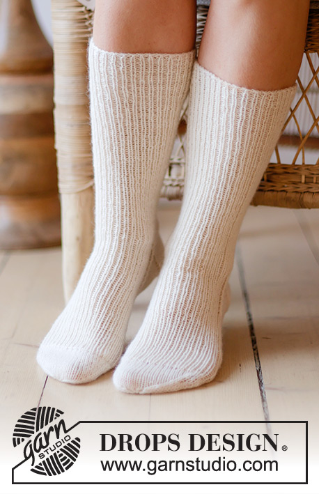 Coconut Cream / DROPS 238-26 - Knitted long socks in DROPS Nord. Piece knitted top down in rib. Size 35 to 43