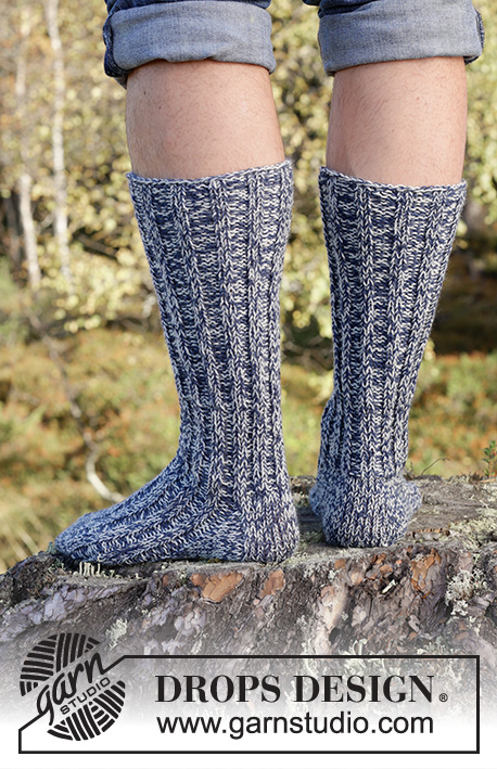 Hiker's Rest Socks / DROPS 246-37 - Knitted socks for men in 2 strands DROPS Fabel. The piece is worked top down with rib. Sizes 38 – 46 = US 6 – 12 1/2.
