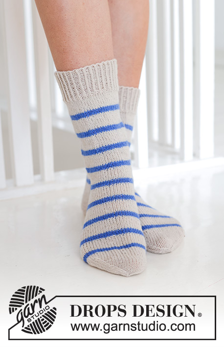 Marina Del Rey Socks / DROPS 247-13 - Knitted socks in DROPS Fabel. Piece is knitted top down in stocking stitch with stripes. Size 35 to 43