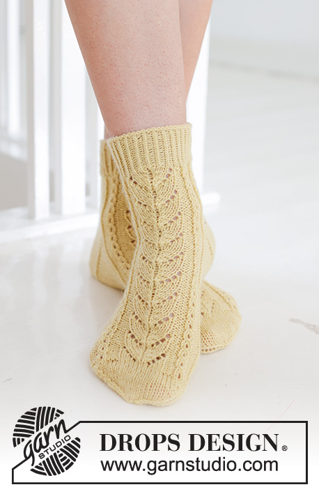 Bright Morning Socks / DROPS 247-20 - Knitted socks in DROPS Nord. Piece is knitted with lace pattern. Size 35-43.