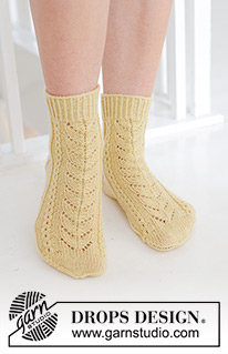 Bright Morning Socks / DROPS 247-20 - Knitted socks in DROPS Nord. Piece is knitted with lace pattern. Size 35-43 = US 4 1/2 – 12 1/2.