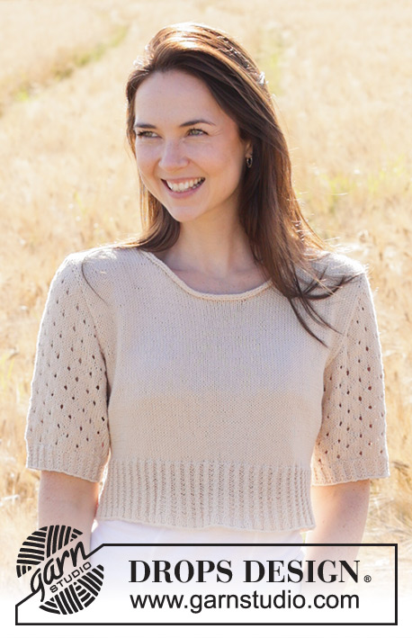 Sand Cove / DROPS 248-27 - Knitted sweater in DROPS Safran. The piece is worked bottom up with round neck, short sewn-in sleeves, lace pattern, cables and I-cord. Sizes S - XXXL.