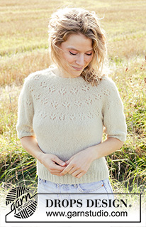 Spring Mist / DROPS 249-27 - Knitted jumper in DROPS Brushed Alpaca Silk. The piece is worked top down with round yoke, lace pattern and short sleeves. Sizes S - XXXL.
