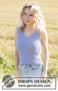 River Trail Top / DROPS 250-28 - Knitted top in DROPS Safran. Piece is knitted bottom up in rib with displacements and V-neck with I-cord at the back of neck. Size: S - XXXL