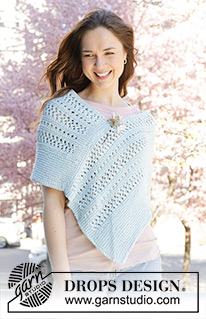 Coastal Dream / DROPS 250-32 - Knitted poncho in DROPS Paris. The piece is worked back and forth with garter stitch and lace pattern. Sizes S - XXXL.
