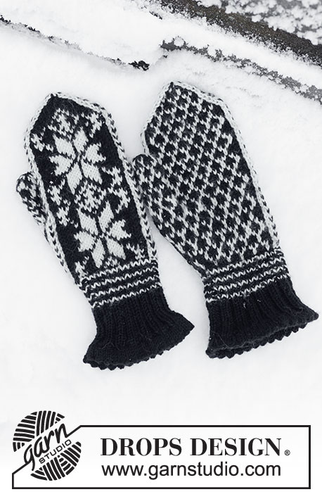 DROPS 28-15 - DROPS heren of dames trui met sneeuwvlok patroon en wanten van “Karisma”. Maat S - L.
