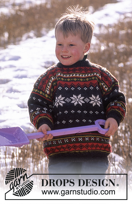 DROPS 52-29 - DROPS Sweater for children in Karisma Superwash with snow crystals and borders.