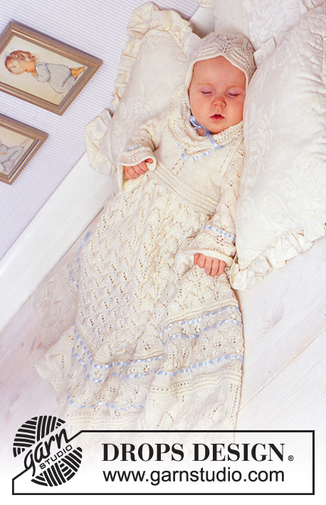 Angel Kissed / DROPS Baby 11-15 - Odświętny komplet: sukienka do chrztu, czapka i kombinezon na drutach