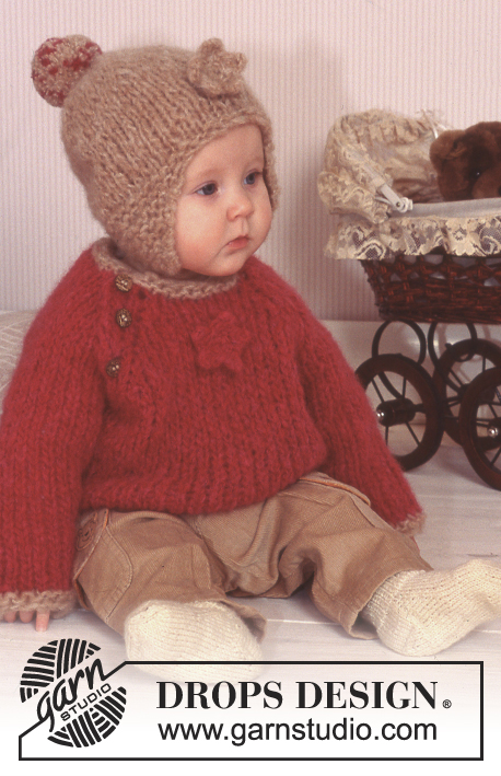 Starry and Warm / DROPS Baby 11-23 - Gruby sweter i czapka na drutach, wykonane 1 nitką włóczki DROPS Snow lub 2 nitkami włóczki DROPS Air, z kwiatem na szydełku. Skarpetki na drutach z włóczki  DROPS BabyMerino.
