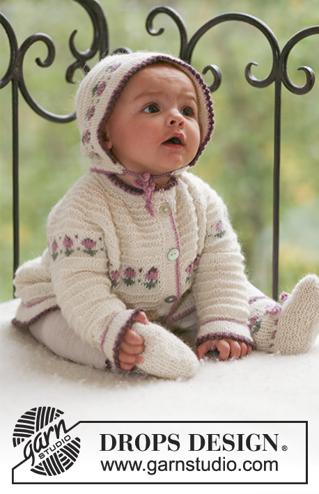 Easter Finest / DROPS Baby 17-14 - Niemowlęcy lub dziecięcy komplet na drutach: rozpinany sweter z zaokrąglonym karczkiem, czapka i kapcie z żakardem w kwiaty, z włóczki DROPS Alpaca