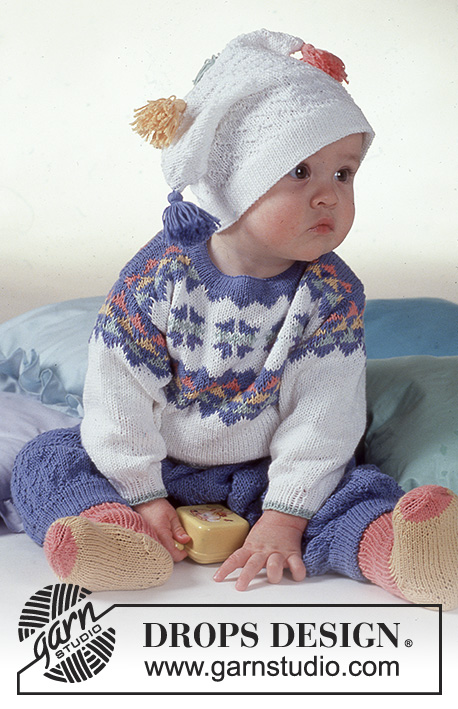 Arlequin Ensemble / DROPS Baby 2-14 - Strikket sett med genser, bukse, lue og sokker til baby i DROPS Camelia eller DROPS Safran. Arbeidet strikkes med flerfarget stjernemønster. Størrelse 3 mnd - 2 år.