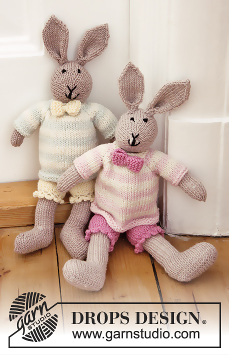 Mrs. Bunny / DROPS Baby 25-36 - Coelho em tricô, com calças, pulôver e laço em DROPS BabyMerino