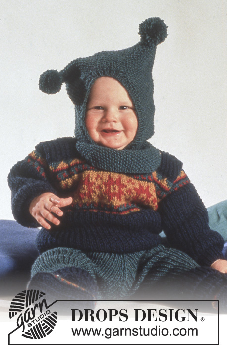 Polichinelle / DROPS Baby 3-14 - DROPS jumper with star pattern, trousers, booties and hat / balaclava with pompoms in “Karisma”.