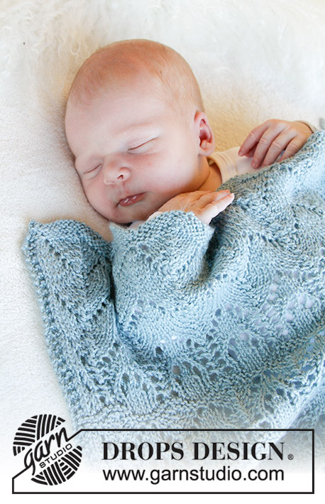 Milk Dreams / DROPS Baby 31-23 - Manta de punto con patrón de calados para bebé. La pieza está tejida en DROPS BabyMerino. Tema: Manta para bebé