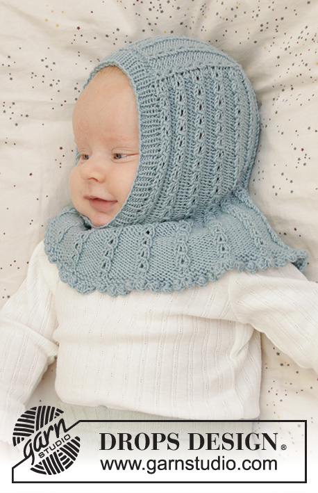 Warm Smiles / DROPS Baby 33-10 - Strikket balaclava / hettelue med hullmønster til baby i DROPS Baby Merino. Størrelse prematur – 2 år