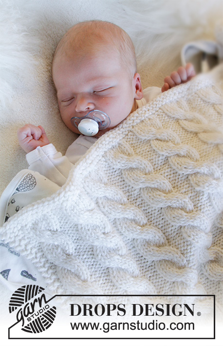 Dream of Cables / DROPS Baby 33-33 - Knitted blanket for baby with cables in DROPS Big Merino. Theme: Baby blanket