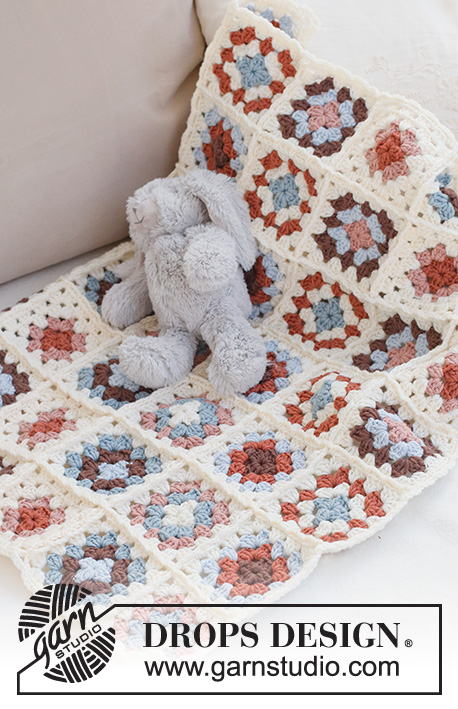 Cuddle Time / DROPS Baby 42-14 - Couverture bébé crochetée avec des carrés type Granny, en DROPS Merino Extra Fine.