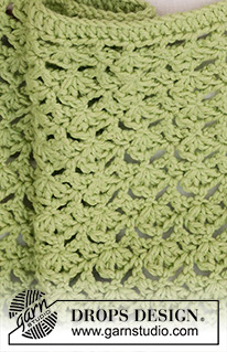 Green Bliss Blanket / DROPS Baby 46-14 - Coperta per bambini lavorata all’uncinetto con motivo traforato in DROPS Cotton Merino.