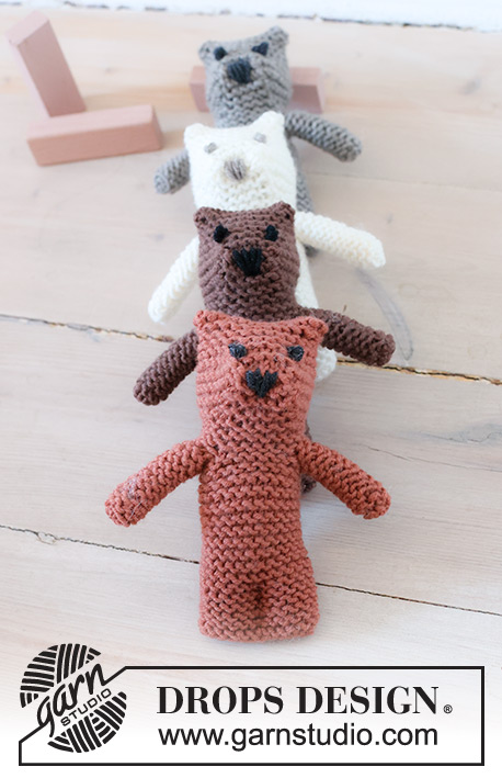 Tiny Bear / DROPS Baby 46-17 - Strikket leke bamse til baby og barn i DROPS Merino Extra Fine. Arbeidet strikkes ovenfra og ned i riller med broderte øyne og snute. Tema: Kosedyr.