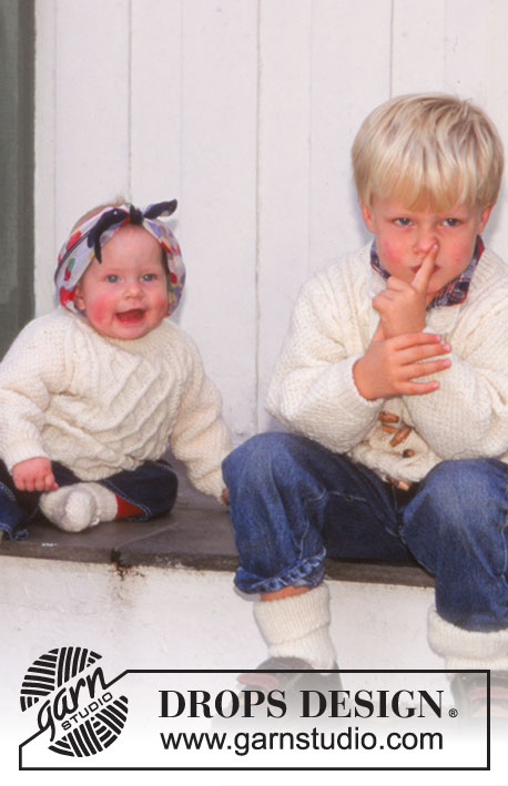 Little Pernille / DROPS Baby 6-2 - DROPS Trui met kabeltjes en raglanmouwen en dekentje van ‘Karisma Superwash’. DROPS Sokken van ‘Babyull’. Thema: babydeken
