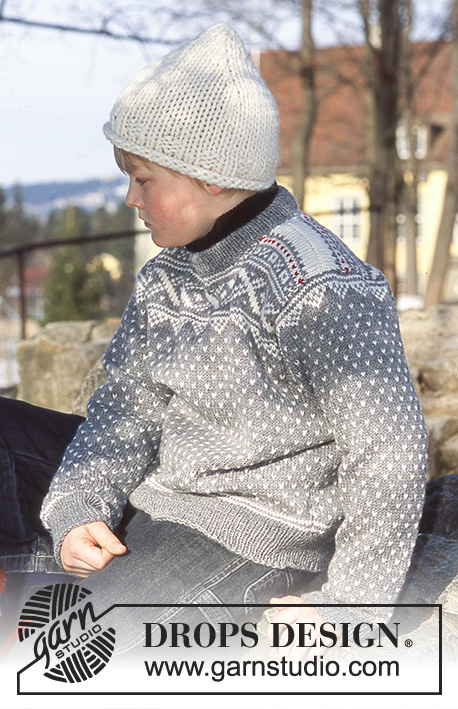 Illias / DROPS Children 12-15 - Strikket sæt til børn med bluse i DROPS Karisma og hue og halstørklæde i DROPS Snow. Arbejdet strikkes med nordisk mønster og retstrik. Størrelse 3 - 14 år.