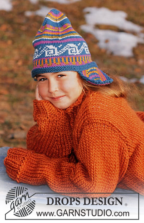 DROPS Children 12-18 - Strikket sæt til børn med bluse i DROPS Snow og hue i DROPS Karisma. Arbejdet strikkes med flerfarvet mønster. Størrelse 3 - 14 år.