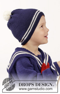 Sailor Aksel / DROPS Children 26-7 - Veste tricotée avec emmanchures raglan et col marin amovible avec nœud. Chaussettes et bonnet avec pompon tricotés en DROPS Merino Extra Fine. Pour enfant du 2 au 10 ans