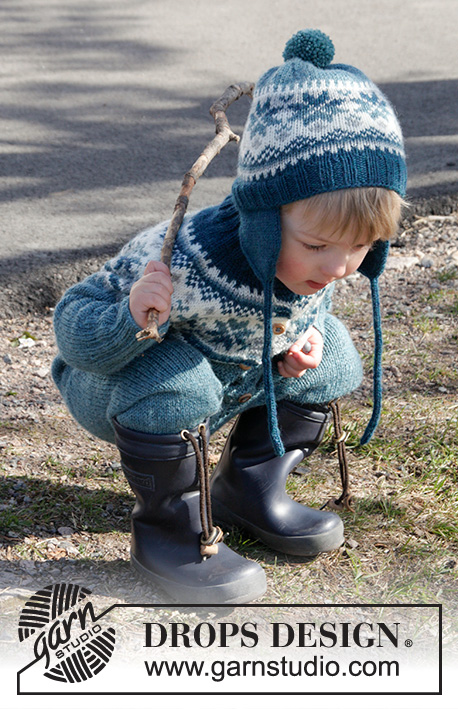 Wild Blueberries / DROPS Children 27-1 - Set of knitted overall worked top down with Nordic pattern and round yoke, plus hat with ear flaps and pompom in DROPS Karisma. Size children 1 - 6 years