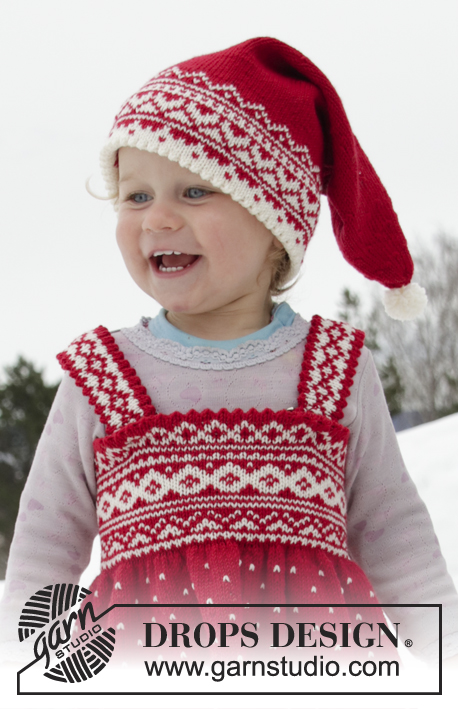 Miss Cookie Hat / DROPS Children 32-1 - Berretto di Natale ai ferri per bambini e ragazzi in DROPS BabyMerino, con un motivo jacquard nordico. Taglie: Da 6/9 mesi a 12 anni.