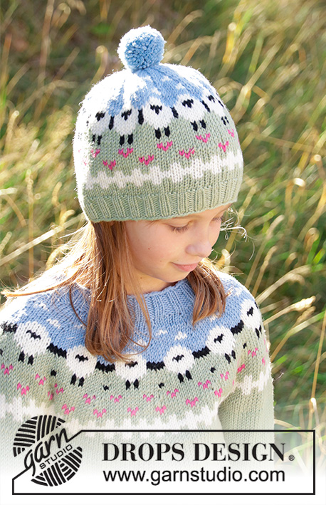 Lamb Dance Hat / DROPS Children 34-2 - Knitted hat for kids in DROPS Merino Extra Fine or DROPS Lima.
Piece is knitted bottom up with sheeps, colour pattern, rib and pompom. Size 3-12 years