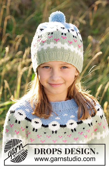 Lamb Dance Hat / DROPS Children 34-2 - Knitted hat for kids in DROPS Merino Extra Fine or DROPS Lima.
Piece is knitted bottom up with sheeps, colour pattern, rib and pompom. Size 3-12 years