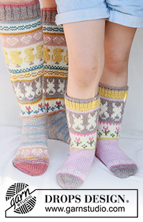 Dancing Bunny Socks / DROPS Children 41-35 - Knitted socks for children in DROPS Karisma. The piece is worked top down in stockinette stitch, with multi-colored pattern and heart, Easter chick, Easter bunny and flower. Sizes 24 – 43 = US 8-12 1/2. Theme: Easter.