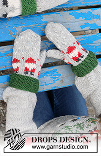 Santa Time Mittens / DROPS Children 44-16 - Knitted mittens for children in DROPS Karisma. The piece is worked bottom up with colored Santa pattern. Sizes 2 – 14 years. Theme: Christmas.
