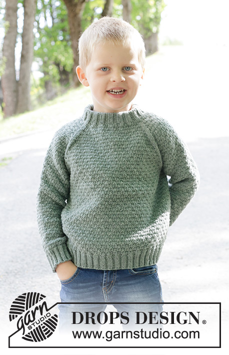 Winter Weekend / DROPS Children 47-33 - Raglánový dětský pulovr s plastickým vzorem pletený shora dolů z příze DROPS Merino Extra Fine. Velikost 2 až 12 let.