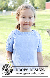 Daisy Fields Top / DROPS Children 48-3 - Knitted short-sleeved sweater/ top, for children in DROPS Cotton Light. The piece is worked top down with raglan and lace pattern on sleeves. Sizes 2 – 12 years.
